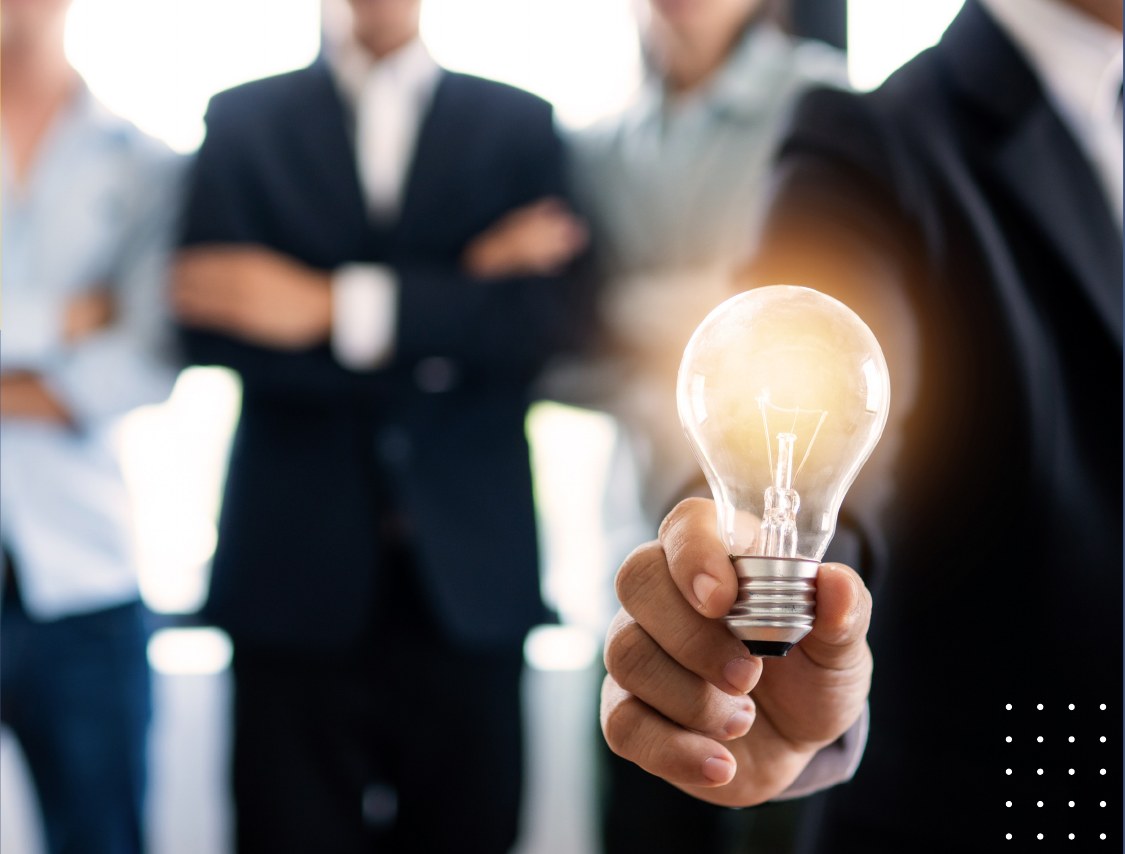 Professional holding a light bulb
